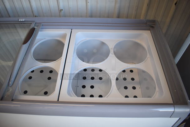 BRAND NEW SCRATCH AND DENT! Avantco 360ADC12HC Metal Commercial Chest Freezer Merchandiser on Commercial Casters. 115 Volts, 1 Phase. 71x28x34. Tested and Working! - Image 8 of 10