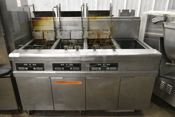 Frymaster FMP345EBLSC Stainless Steel Commercial Natural Gas Powered 3 Bay Deep Fat Fryer w/ Right Side Dumping Station on Commercial Casters. 122,000 BTU.  - Image 1 of 12