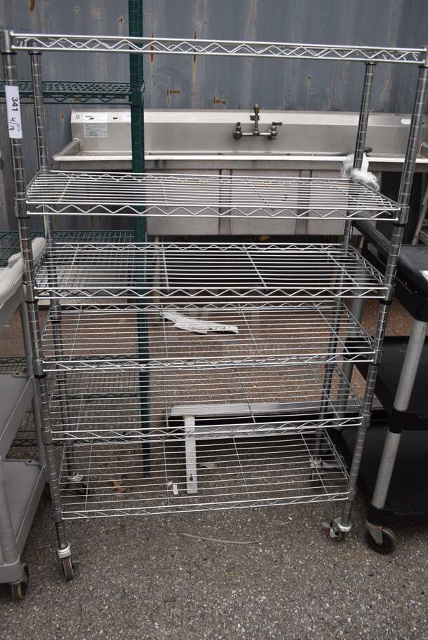 Chrome Finish 6 Tier Wire Shelving Unit on Commercial Casters. BUYER MUST DISMANTLE. PCI CANNOT DISMANTLE FOR SHIPPING. PLEASE CONSIDER FREIGHT CHARGES.  - Image 1 of 1