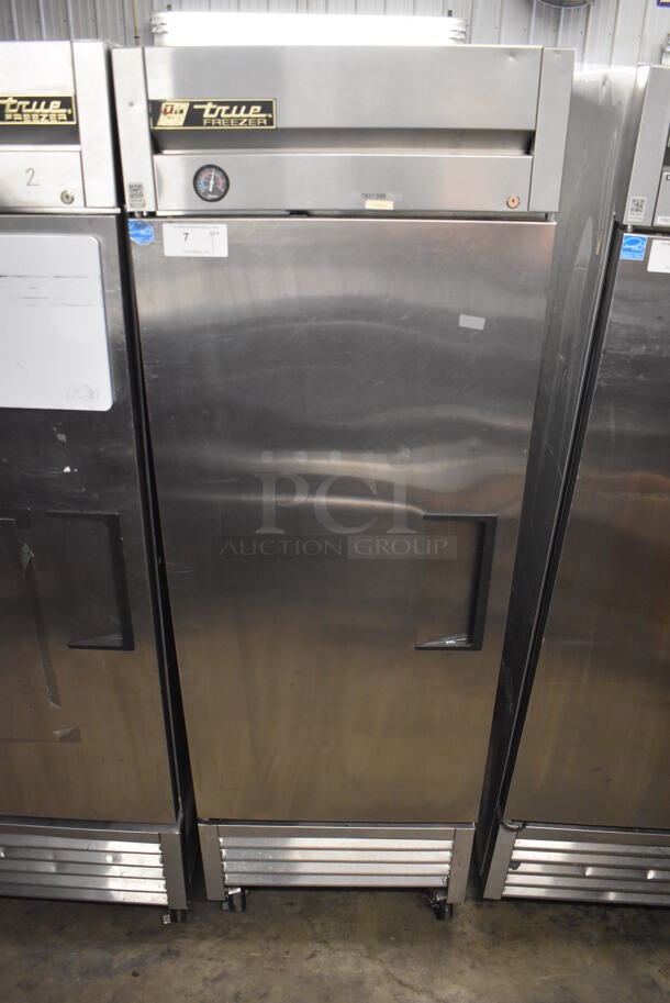 2013 True T-23F ENERGY STAR Stainless Steel Commercial Single Door Reach In Freezer w/ Poly Coated Racks on Commercial Casters. 115 Volts, 1 Phase. 27x30x83.5. Tested and Powers On But Does Not Get Cold