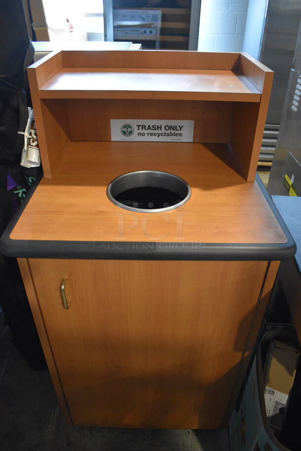 Commercial Trash Receptacle With Circular Top Opening And Recessed Top Tray In Wood Style Finish With Large Black Trash Can on Commercial Casters.