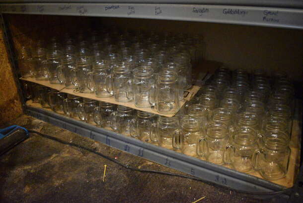 Gray Metal 5 Tier Shelving Unit w/ Contents Including Tall Glass Mugs and Wine Glasses. 48x24x72. BUYER MUST REMOVE; BUYER MUST DISMANTLE. PCI CANNOT DISMANTLE FOR SHIPPING. PLEASE CONSIDER FREIGHT CHARGES. (glass room - off of bar area) - Image 2 of 6