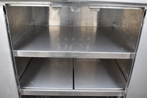 Stainless Steel Commercial Table w. 4 Doors and Back Splash. 72x32.5x42.5 - Image 3 of 6