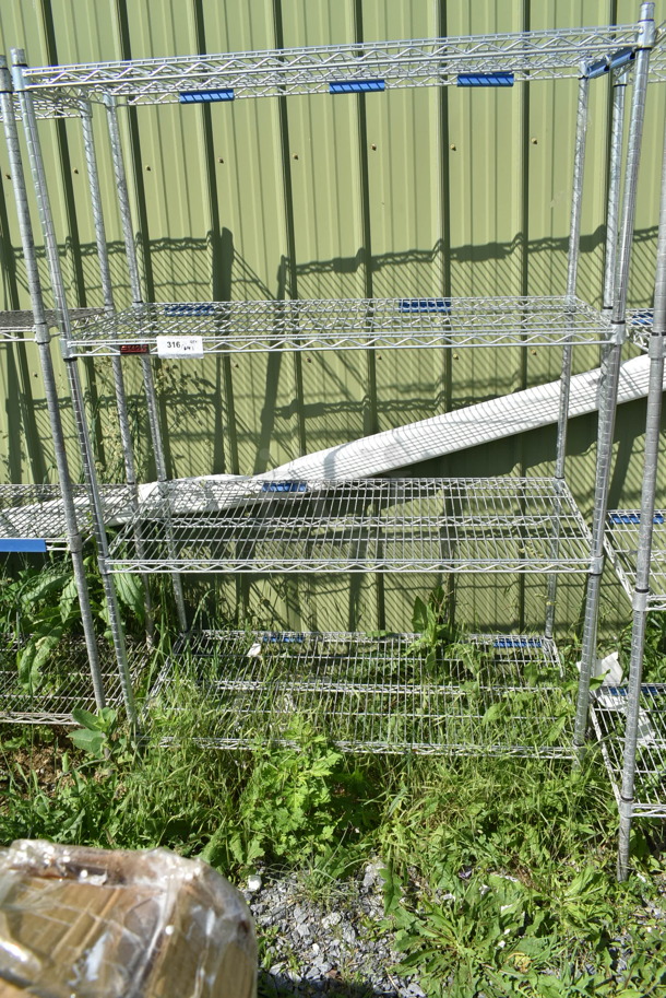 Chrome Finish 4 Tier Wire Shelving Unit. BUYER MUST DISMANTLE. PCI CANNOT DISMANTLE FOR SHIPPING. PLEASE CONSIDER FREIGHT CHARGES. - Image 1 of 2