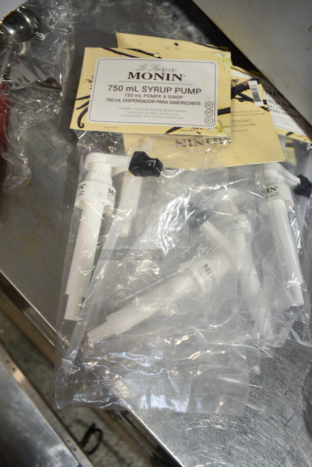 4 BRAND NEW SCRATCH AND DENT! Items Including 407TPD24RD Choice #24 Red Thumb Press Disher - 1.33 oz., 714QV12 Outset® QV12 18" Stainless Steel Ultra-Thin Slotted Turner with Bamboo Handle, Monin Syrup Pumps, Strainer. 4 Times Your Bid!  - Image 8 of 9