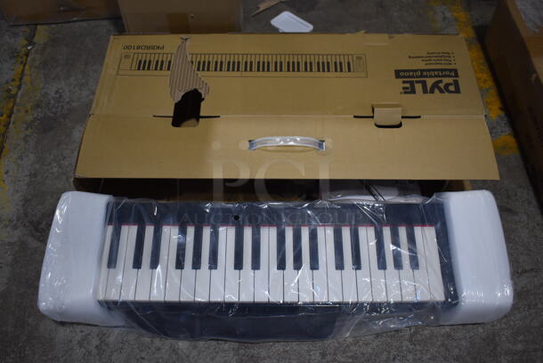 BRAND NEW IN BOX! Pyle PKBRD8100 Electric Folding Musical Keyboard. 28x7x4
