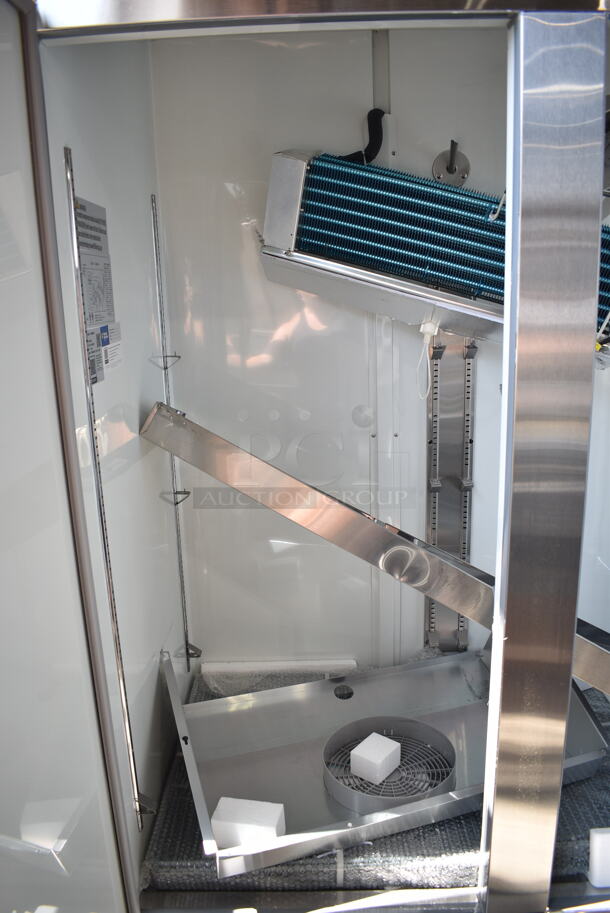 BRAND NEW SCRATCH AND DENT! 2024 Avantco 178A49FHC Stainless Steel Commercial 2 Door Reach In Freezer w/ Poly Coated Racks on Commercial Casters. 115 Volts, 1 Phase. Cannot Test - Interior Pieces are Detached - Image 8 of 9