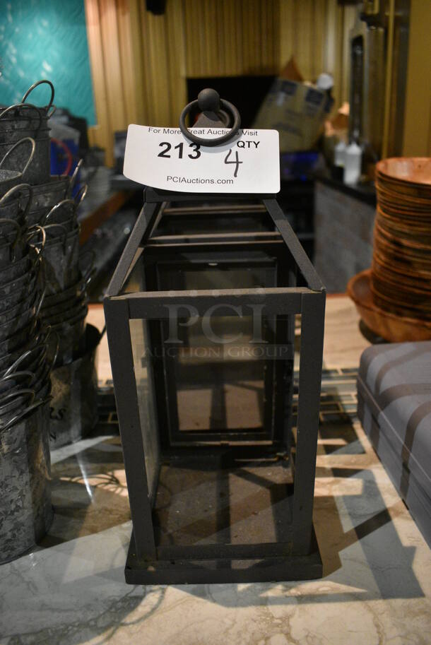 4 Metal Lanterns. 6.5x6.5x4. 4 Times Your Bid! (bar)