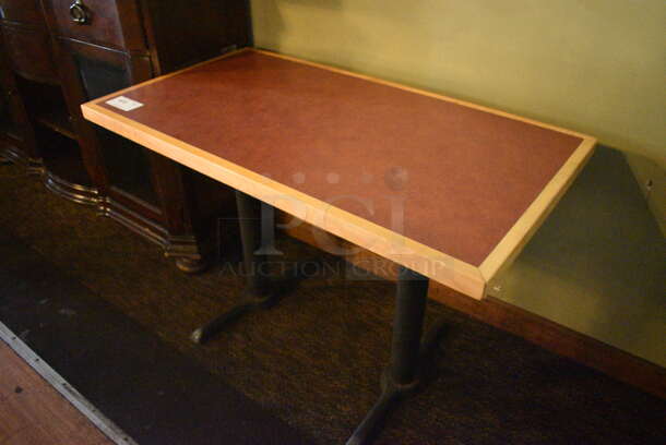 Brown Tabletop on 2 Black Metal Straight Leg Bases. BUYER MUST REMOVE. 44x24x30. (Susquehanna Ale House)