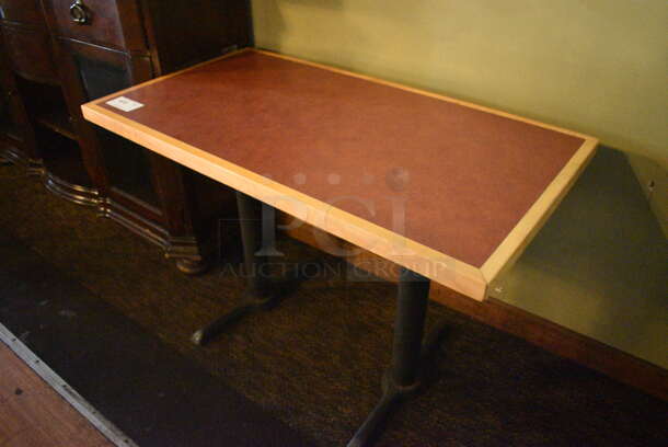 Brown Tabletop on 2 Black Metal Straight Leg Bases. BUYER MUST REMOVE. 44x24x30. (Susquehanna Ale House) - Image 1 of 3