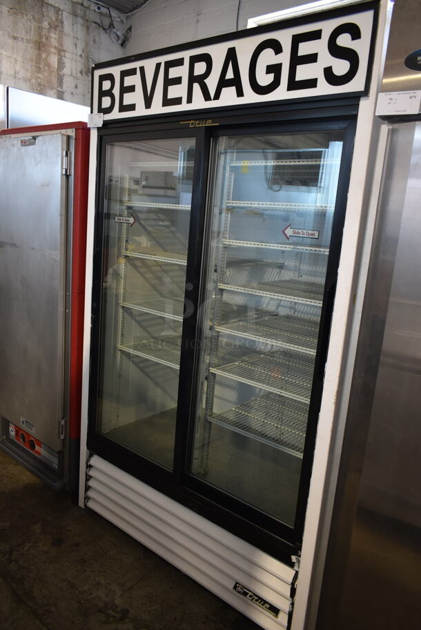 True GDM-41 Metal Commercial 2 Door Reach In Cooler Merchandiser w/ Poly Coated Racks. 115 Volts, 1 Phase. Tested and Powers On But Does Not Get Cold