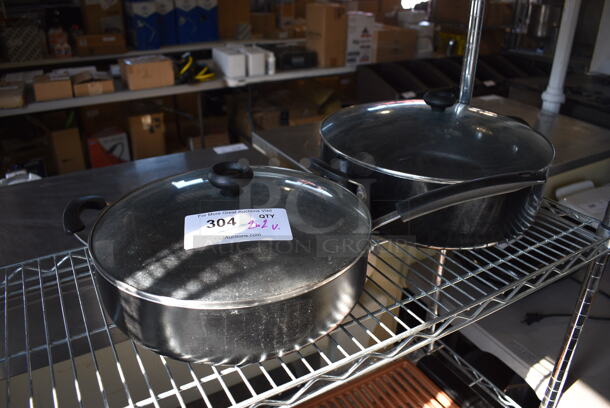 2 Metal Sauce Pots w/ Lids. 21.5x12x7, 18x14x8. 2 Times Your Bid!