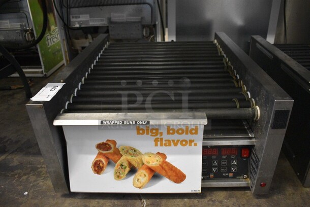 2017 Star Model 45STBDE Stainless Steel Commercial Countertop Hot Dog Roller Grill w/ Bun Storage Bin. 120 Volts, 1 Phase. 24x28.5x12. Tested and Gets Warm But Rollers Do Not Move