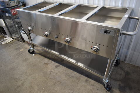 BRAND NEW SCRATCH AND DENT! 2022 Backyard Pro 554BPGST4WLP Stainless Steel Commercial Propane Gas Powered 4 Well Steam Table w/ Under Shelf on Commercial Casters.