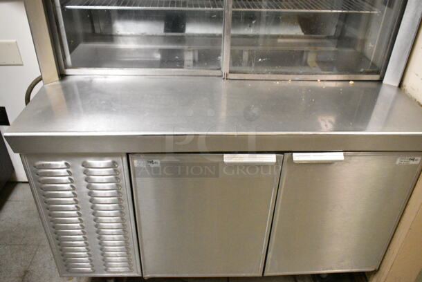 Delfield Stainless Steel Commercial Refrigerated Prep Table w/ 2 Lower Doors. BUYER MUST REMOVE: Bring Tools and Manpower Needed To Remove This Item. This Unit Was In Working Condition When the Restaurant Closed. (kitchen entryway) - Image 6 of 7