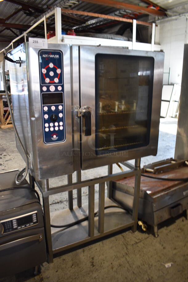 Alto Shaam Model 10.10 MI Stainless Steel Commercial Electric Powered Combitherm Convection Oven w/ View Through Door and Metal Oven Racks on Metal Stand. 208-240 Volts, 3 Phase. 40x30x66