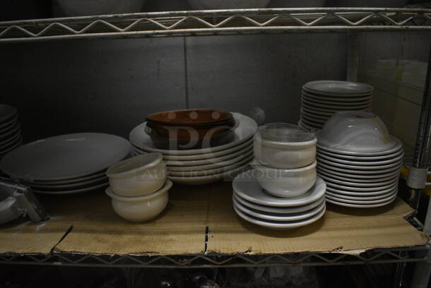 White Finish 5 Tier Shelving Unit w/ Contents Including White Ceramic Dishes, Baskets, Utensils. 48x18x74. BUYER MUST REMOVE. BUYER MUST DISMANTLE. PCI CANNOT DISMANTLE FOR SHIPPING. PLEASE CONSIDER FREIGHT CHARGES. (kitchen) - Image 6 of 11