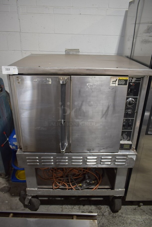 American Range Stainless Steel Commercial Propane Gas Powered Full Size Convection Oven w/ Solid Doors and Metal Oven Racks on Commercial Casters.