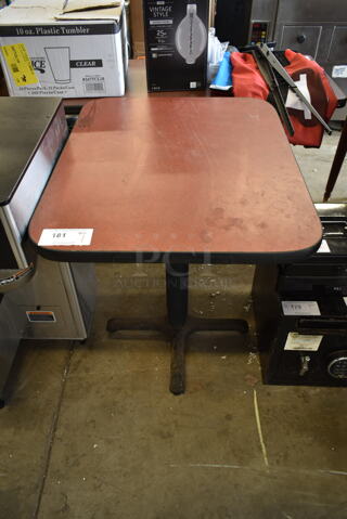 Brown Dining Height Table on Black Metal Table Base.
