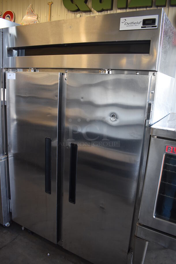 2011 Delfield 6151XL-S 6000XL Stainless Steel Commercial 2 Door Reach In Freezer w/ Metal Racks on Commercial Casters. 115 Volts, 1 Phase. 51x32x79. Tested and Working!