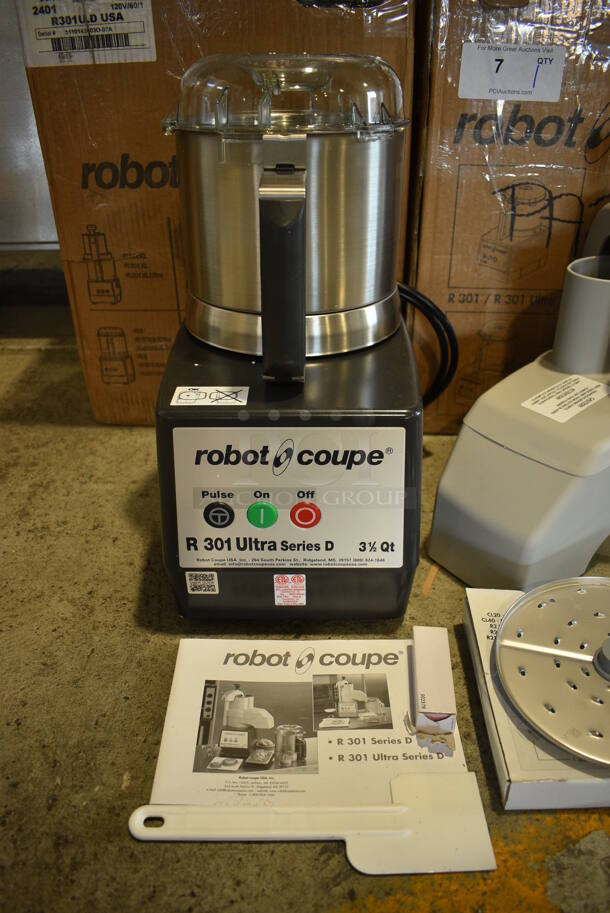 BRAND NEW SCRATCH AND DENT! Robot Coupe Model R 301 U Series D Metal Commercial Countertop Food Processor w/ Bowl, Lid, S Blade, Slicing Blade, Grating Blades and Continuous Feed Head Attachment. 120 Volts, 1 Phase. 8x12x17. 8.5x13x14. Tested and Working! - Image 2 of 9