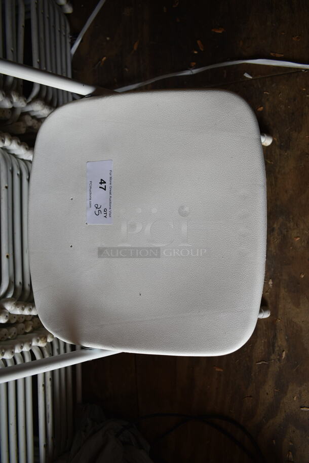 50 White Poly and Metal Folding Chairs. Stock Picture - Cosmetic Condition May Vary. 50 Times Your Bid! BUYER MUST REMOVE.(outside shed) - Image 4 of 5