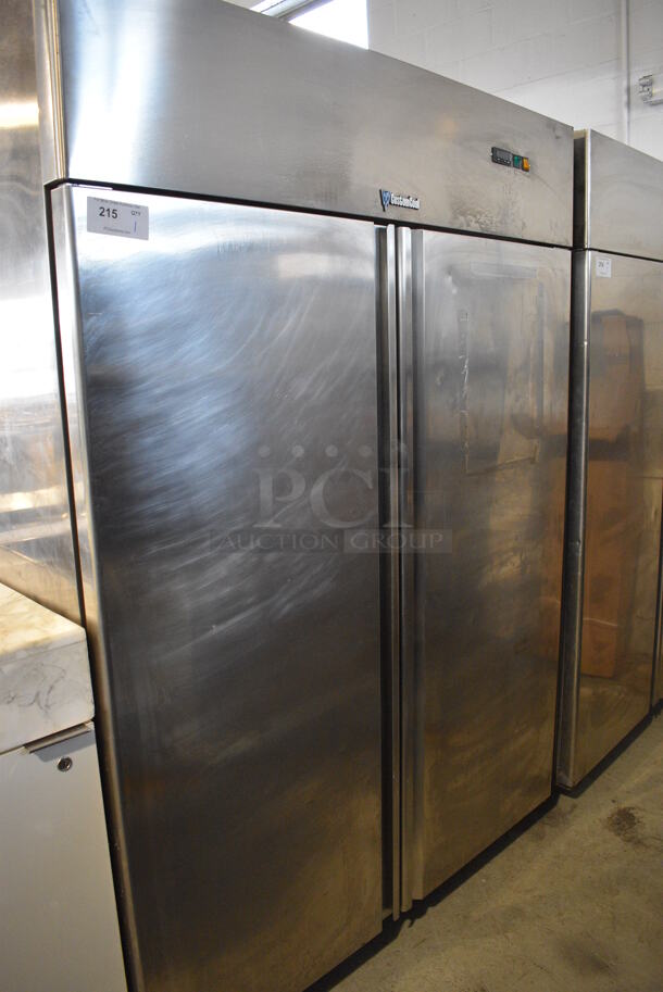 CustomCool Stainless Steel Commercial 2 Door Reach In Cooler w/ Poly Coated Racks on Commercial Casters. 115 Volts, 1 Phase. 55.5x32x80. Tested and Powers On But Temps at 52 Degrees
