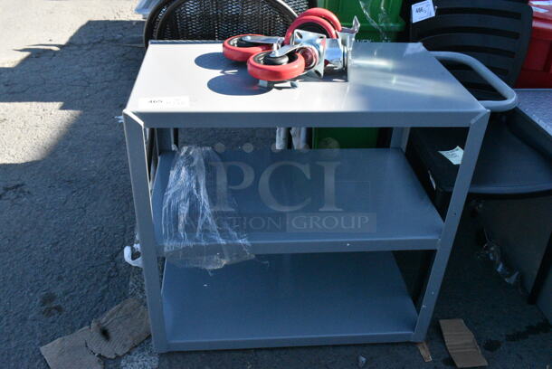 BRAND NEW SCRATCH AND DENT! Lavex Gray Metal 3 Tier Cart w/ Commercial Casters.  - Image 1 of 5