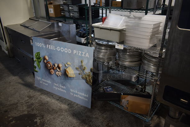 ALL ONE MONEY! Lot of Items on Shelving Unit and Sign; Includes Metal Round Baking Pans and Poly Drop In Bins. Does Not Include Shelving Unit.  - Image 1 of 6