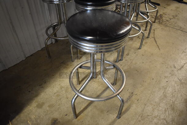 4 Metal Swivel Stools w/ Black Seat Cushion. Stock Picture - Cosmetic  Condition May Vary.  17.5x17.5x30.5. 4 Times Your Bid!