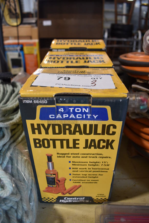 3 BRAND NEW IN BOX! Central Hydraulics 4 Ton Capacity Hydraulic Bottle Jacks. 3 Times Your Bid!