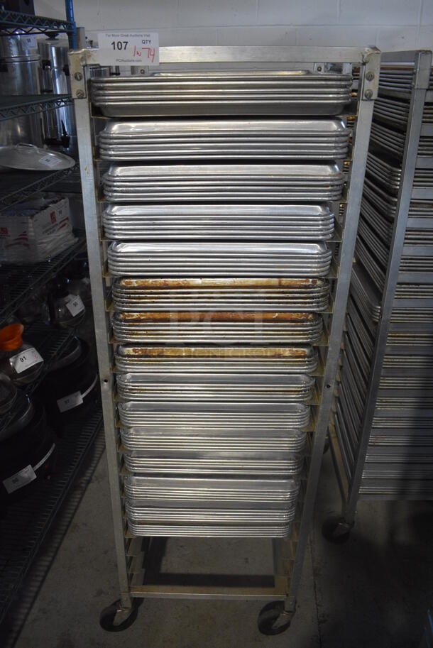 Metal Commercial Pan Transport Rack on Commercial Casters w/ 74 Metal Full Size Baking Pans. 20.5x26.5x63. Pans 18x26x1