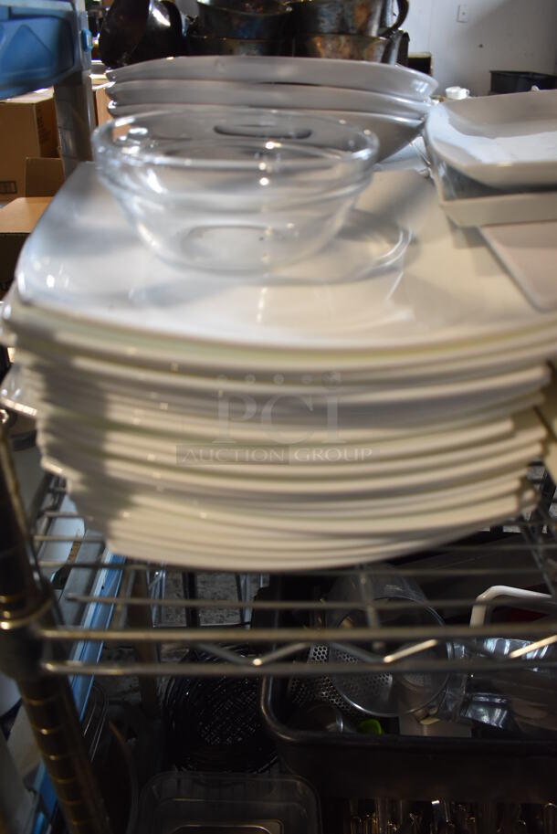 ALL ONE MONEY! Lot of Chrome Finish 3 Tier Shelving Unit on Commercial Casters w/ Contents Including Ceramic Dishes, Silverware and Poly Bins. BUYER MUST DISMANTLE. PCI CANNOT DISMANTLE FOR SHIPPING. PLEASE CONSIDER FREIGHT CHARGES. 24x24x68 - Image 4 of 11