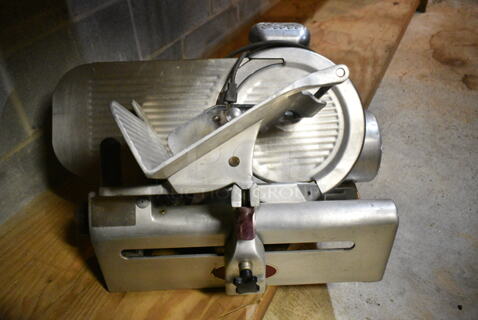 Globe 400 Stainless Steel Commercial Countertop Meat Slicer. 115 Volts, 1 Phase. This Unit Was In Working Condition When the Restaurant Closed. (basement)