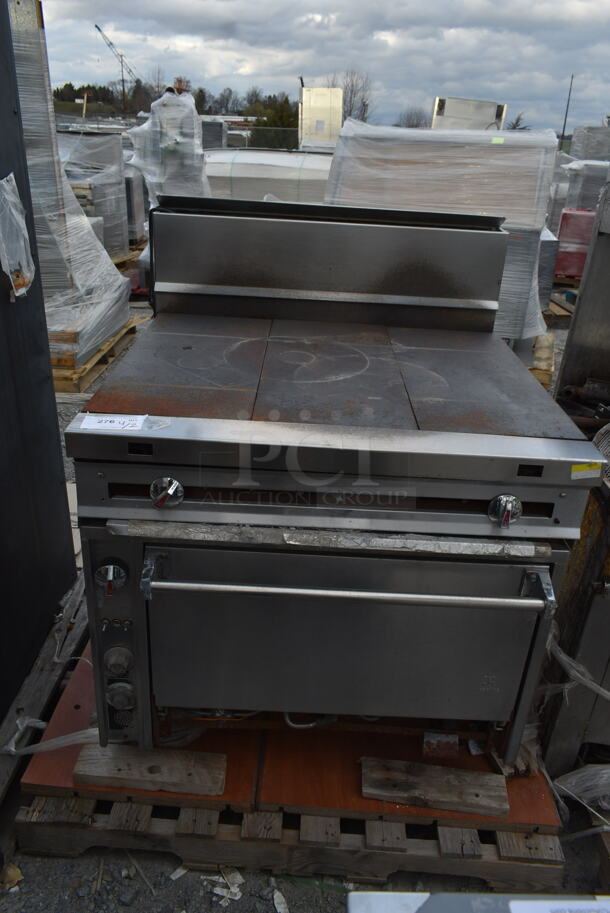 Jade Range Stainless Steel Commercial Natural Gas Powered Flat Top Range w/ Convection Oven and Back Splash.