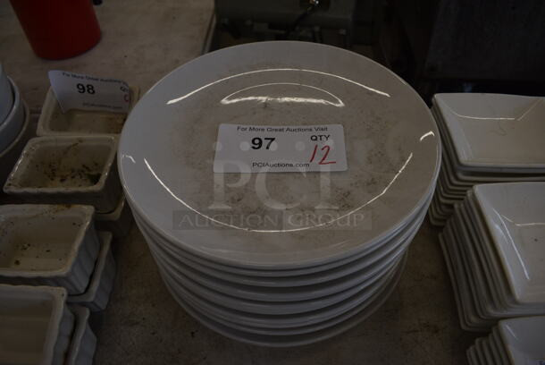 12 White Ceramic Plates. 10x10x1. 12 Times Your Bid!