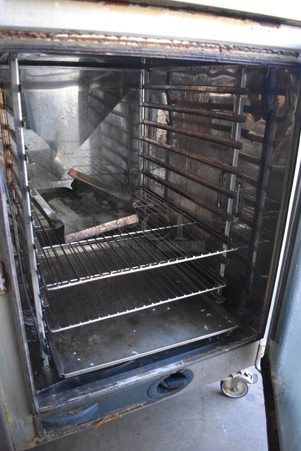 2 2016 Rational Stainless Steel Commercial Combitherm Self Cooking Center Convection Ovens on Commercial Casters. Top Model: SCC WE 62. Bottom Model: SCC WE 102. Picture of Unit Powered on is Included. 480 Volts, 3 Phase. 42x40x73. 2 Times Your Bid! - Image 6 of 6