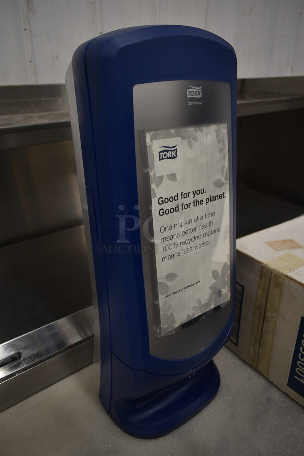 BRAND NEW IN BOX! Tork Blue and Clear Poly Napkin Dispenser. - Image 2 of 5