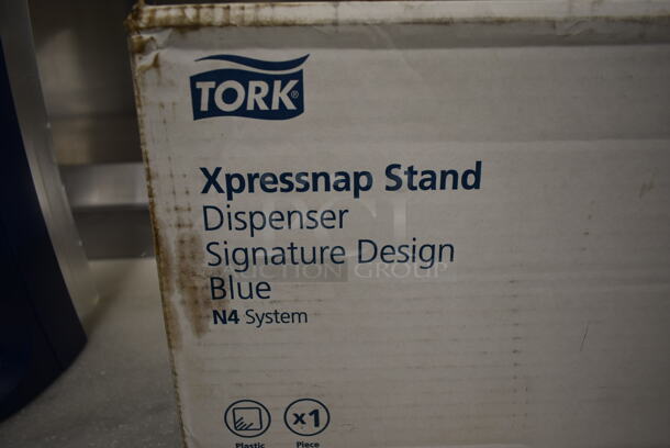 BRAND NEW IN BOX! Tork Blue and Clear Poly Napkin Dispenser. - Image 5 of 5