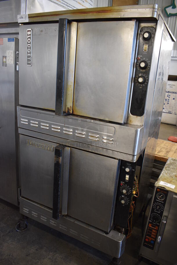 2 Blodgett Stainless Steel Commercial Natural Gas Powered Full Size Convection Oven w/ Solid Doors, Metal Oven Racks and Thermostatic Controls on Commercial Casters. 38x38x73