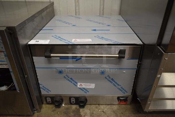 BRAND NEW SCRATCH AND DENT! Vollrath 40848 Cayenne Stainless Steel Commercial Countertop Electric Powered Pizza Oven w/ Cooking Stones. 208-240 Volts, 1 Phase.