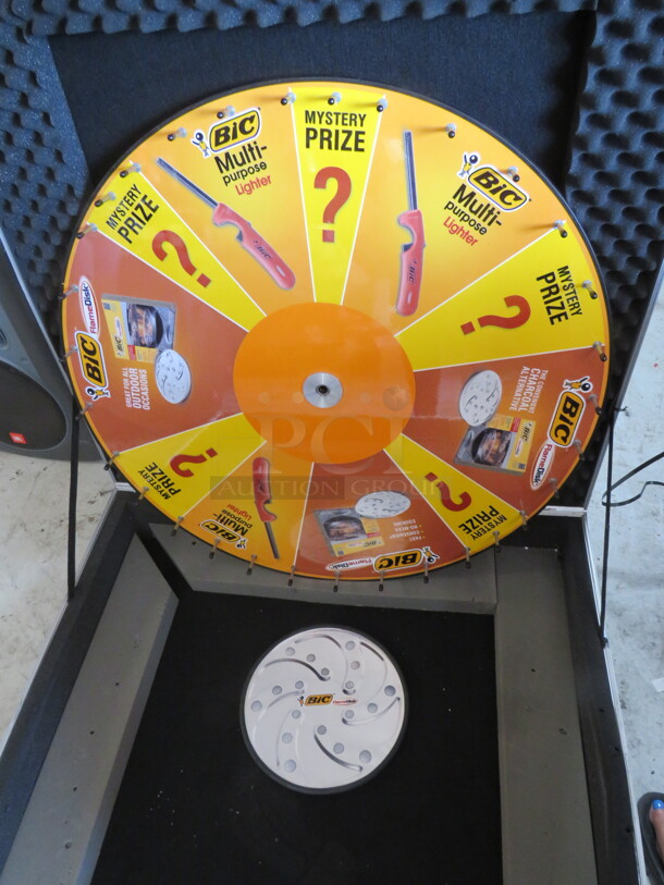 One Hard Shell Case With Wheel Spin Game. 40X40X9  - Image 2 of 2