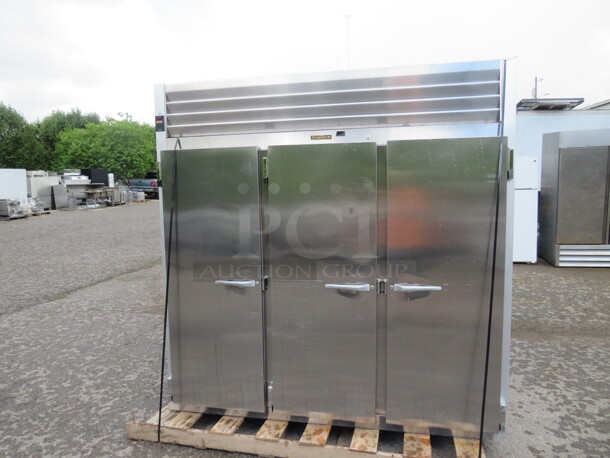 One WORKING 3 Door Stainless Steel Traulsen Refrigerator With 9 Racks, On Casters. 115 Volt. Model# G30011. 77X35X83.5. $9176.00. - Image 1 of 6