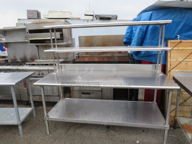 One Stainless Steel Table With Stainless Under Shelf, And 2 Stainless Over Shelves. 72X30X65