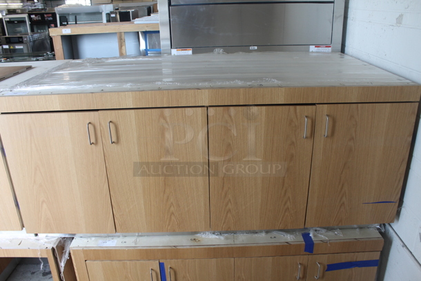 BRAND NEW! Commercial 4 Door Cabinet In Wood Style Finish With White Shelves. - Image 1 of 5