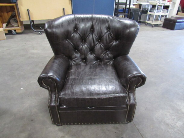 One AWESOME Brown Leather Look Over Stuff Chair. VERY COMFY