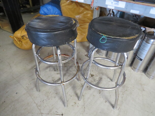 Double Chrome Ring Bar Stool With A Black Cushioned Swivel Seat. Need To Be Recovered. 2XBID - Image 1 of 1