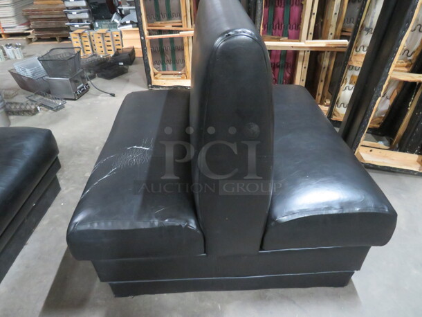 One Double Sided Booth With Black Cushioned Seat And Back. 48X48X43
