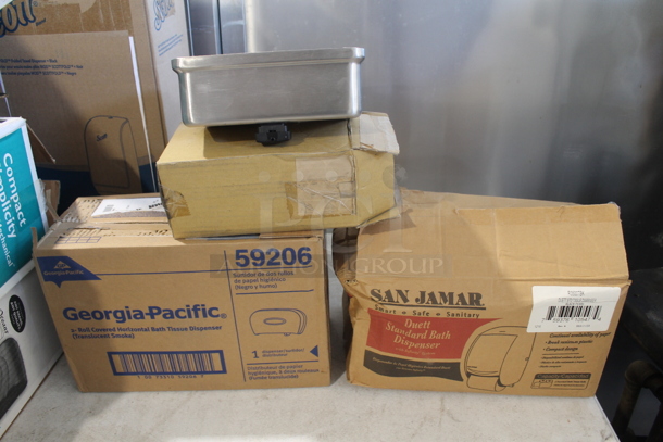 3 Various BRAND NEW IN BOX! Dispensers. Includes Hand Towel, Soap and Toilet Paper. 3 Times Your Bid!