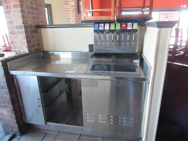 One Stainless Steel Drink Station With 1 SS Door, SS Under Shelf And 8 Flavor Cornelius Soda Dispenser With Ice Well. BUYER MUST REMOVE 62X28X40